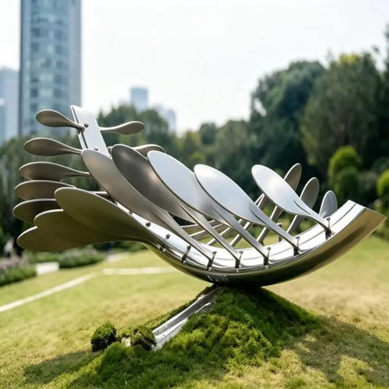 Comment une sculpture en anneau en acier inoxydable poli miroir est-elle fabriquée et installée ?